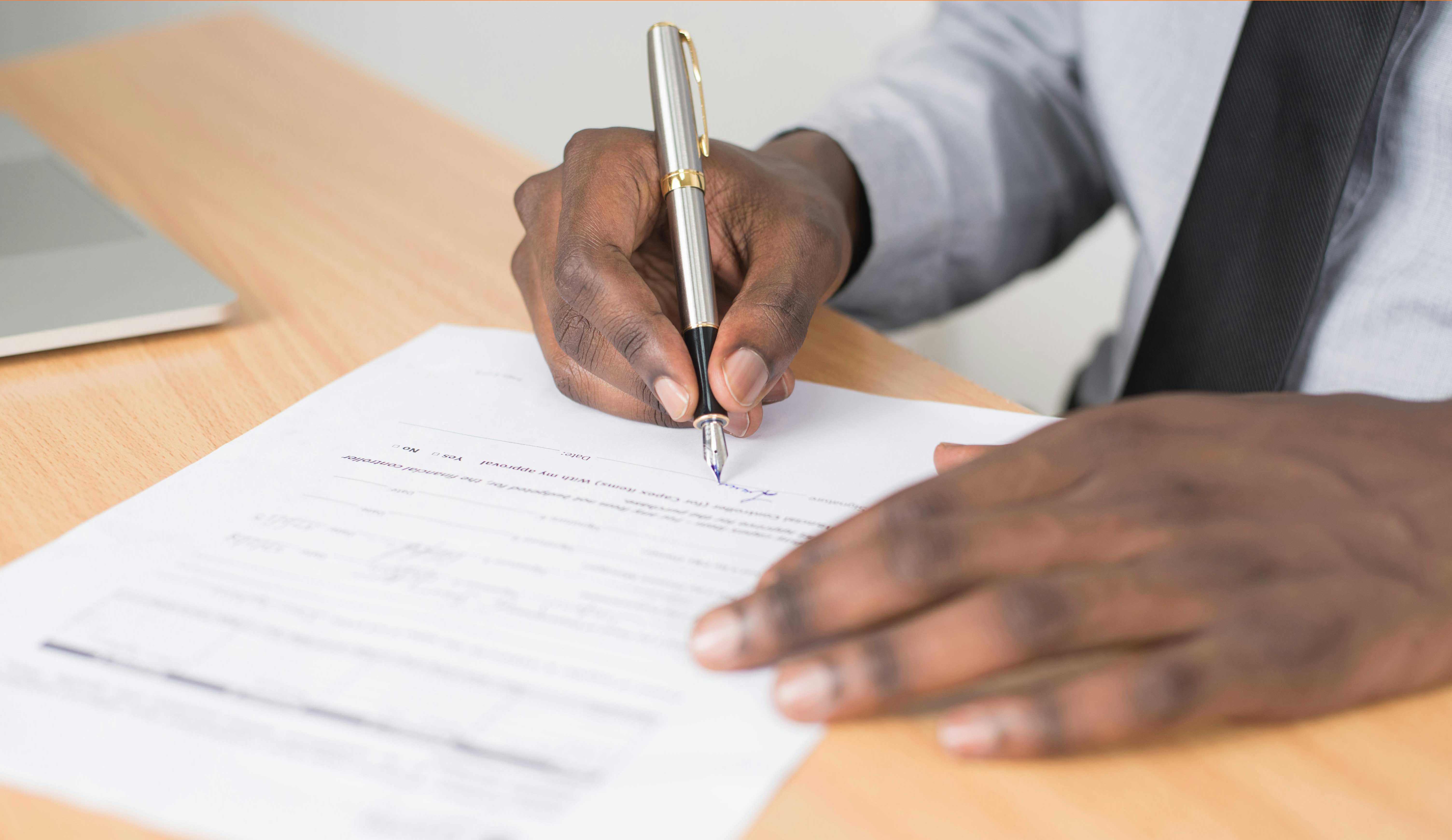car-title-being-signed-by-man